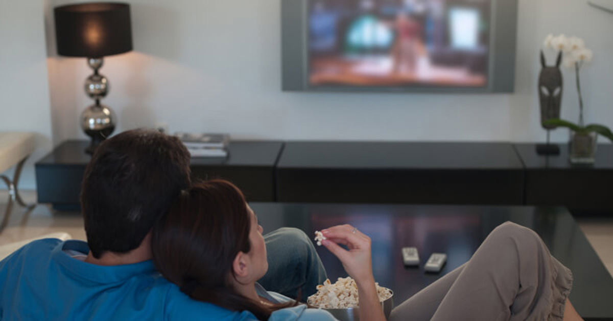 A couple watching TV