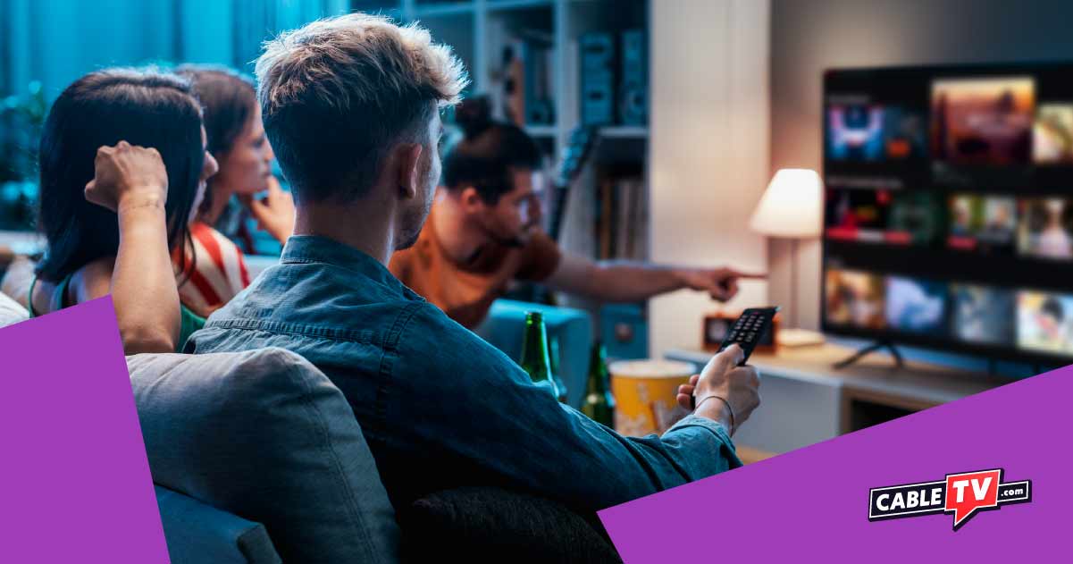 A group of friends watching streaming on TV