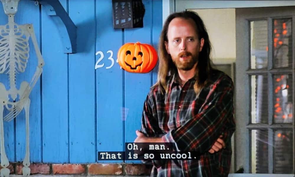 High school counselor Jeff Rosso watches students speed off after they smashed his jack-o’-lantern in one of the Best Halloween TV episodes from Freaks and Geeks.