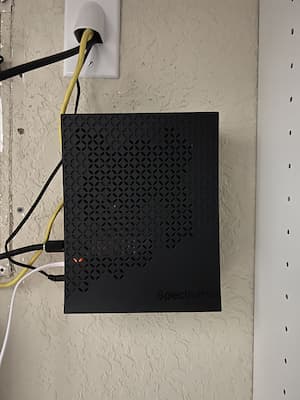 Picture of a Spectrum Modem installed on a wall