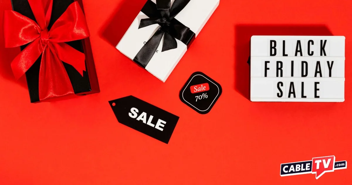 Black Friday Sale on an orange-red background with wrapped gift boxes and a tag that says Sale